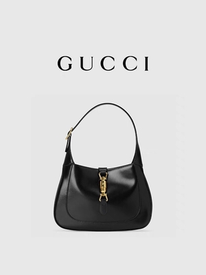 لوازم جانبی طلایی کلاسیک چرم مشکی 1961 توسط Gucci Time Honored