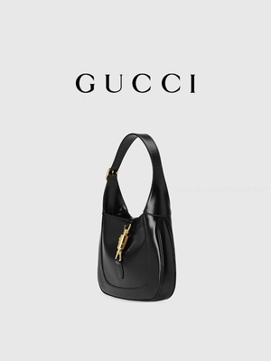 لوازم جانبی طلایی کلاسیک چرم مشکی 1961 توسط Gucci Time Honored