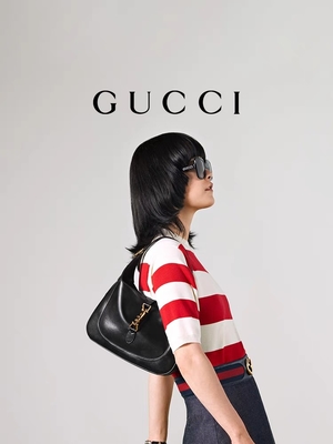 لوازم جانبی طلایی کلاسیک چرم مشکی 1961 توسط Gucci Time Honored